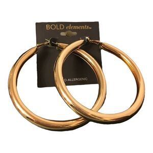 Bold elements imitation  gold hoop earrings.  NWT